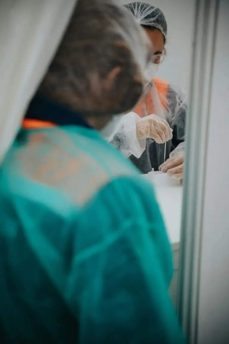 Regulatory professionals reviewing clinical documentation in a controlled environment.
